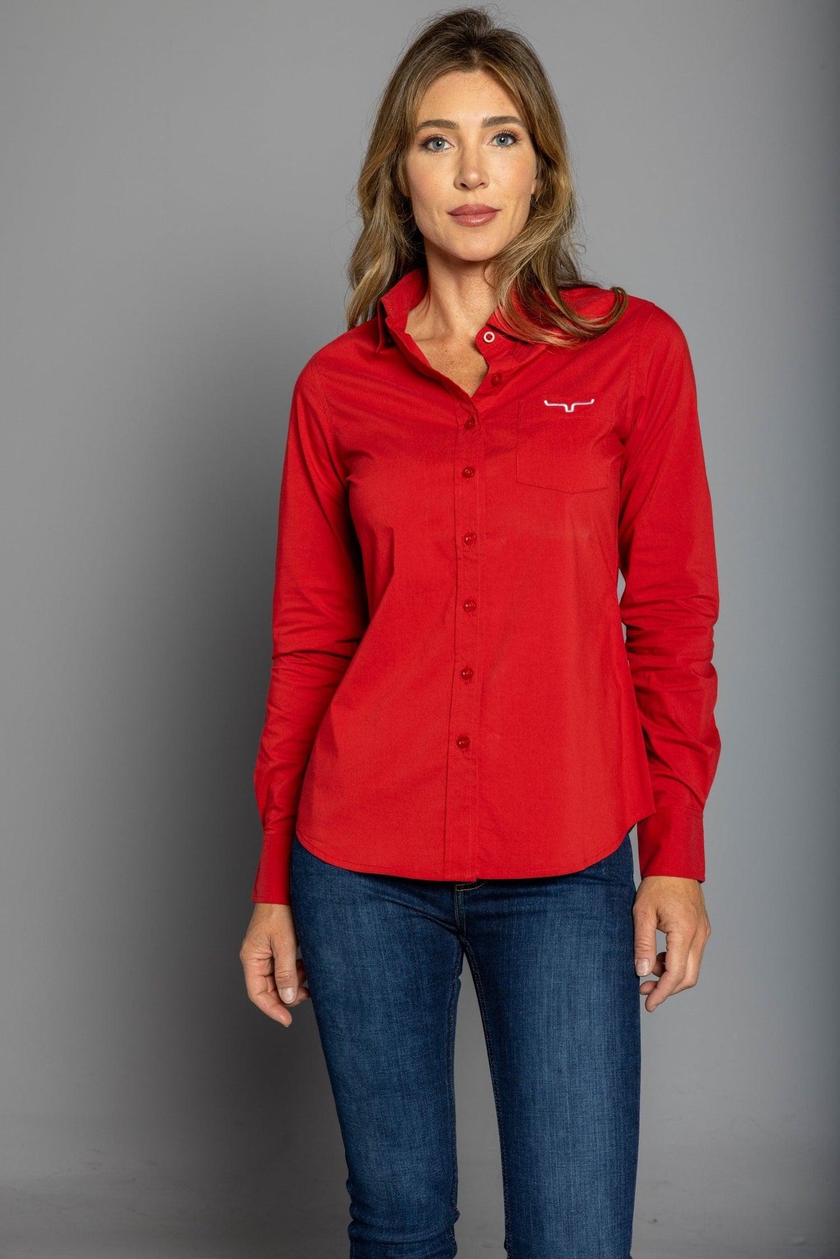 Kimes Ranch Ladies KR Team Shirt in Red with long sleeves, a button front, and the Kimes Ranch logo on the chest pocket
