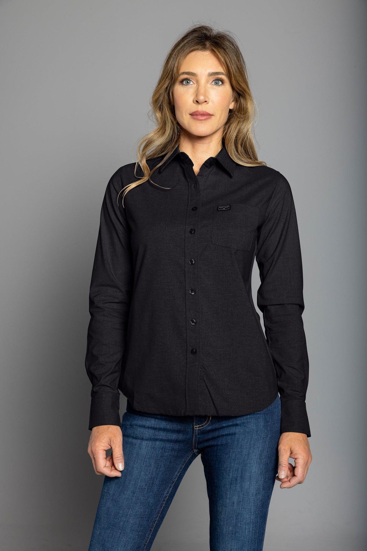 Kimes Ranch Ladies Linville long sleeve button-up top in Black with a chest pocket and logo
