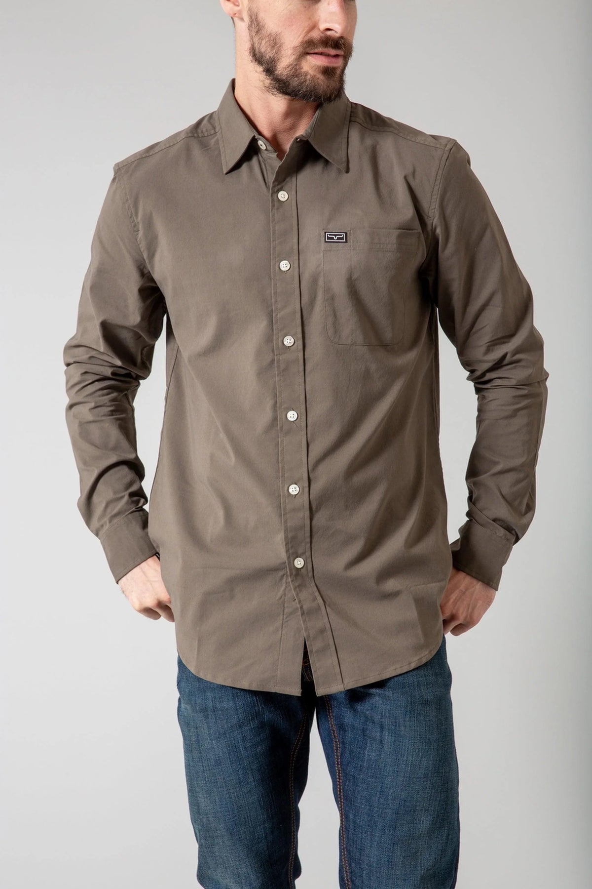 Kimes Ranch Linville Long Sleeve Dress Shirt in Army with a button-down collar and a chest pocket with the Kimes Ranch logo