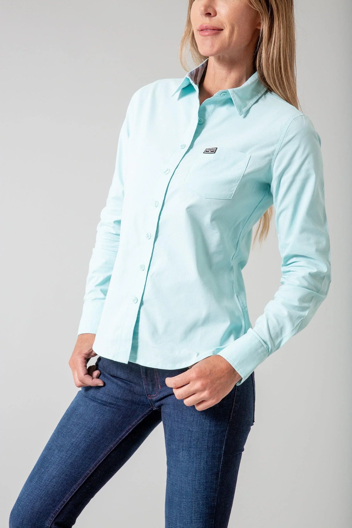 Kimes Ranch Ladies Linville long sleeve button-up shirt in Turquoise with a chest pocket and logo