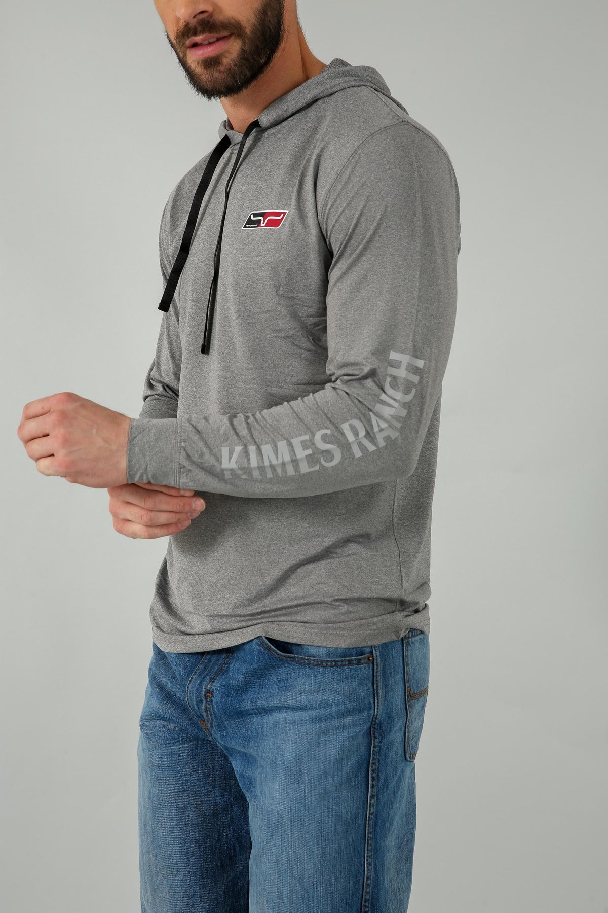 Kimes Ranch Ninja Hood Tech Tee Shirt in Grey Heather, side view, with Kimes Ranch logo on chest and sleeve text