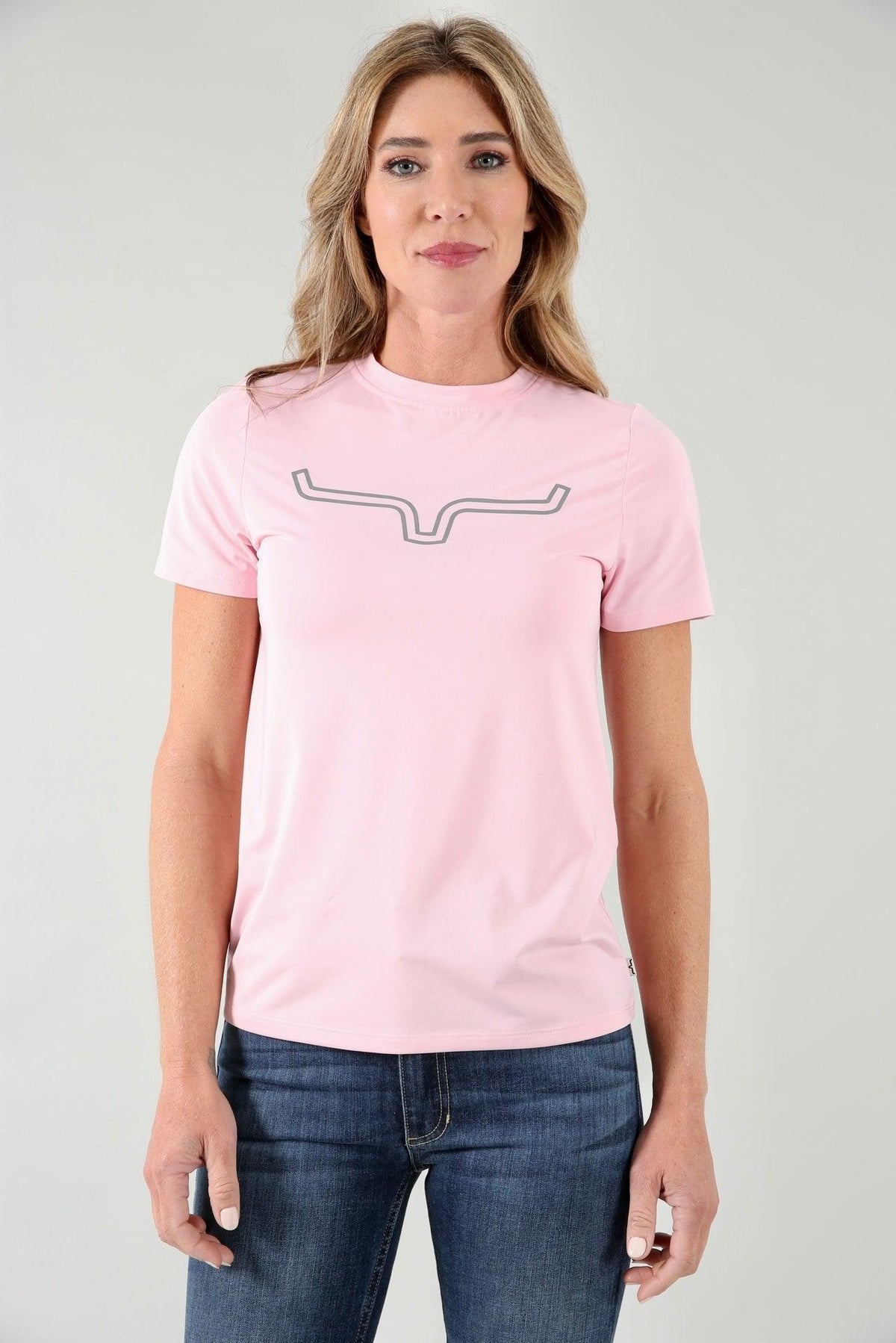 Kimes Ranch Ladies Outlier Tech Tee Shirt in Blush with a grey logo outline on the chest