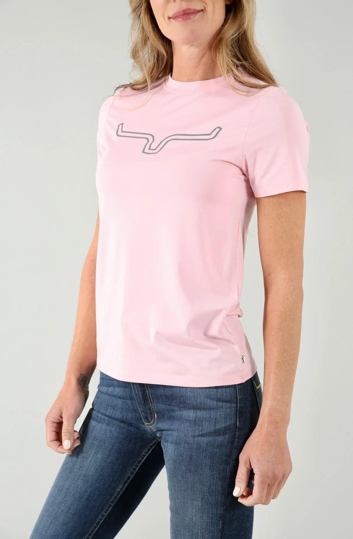 Kimes Ranch Ladies Outlier Tech Tee Shirt in Blush with a grey logo outline on the chest