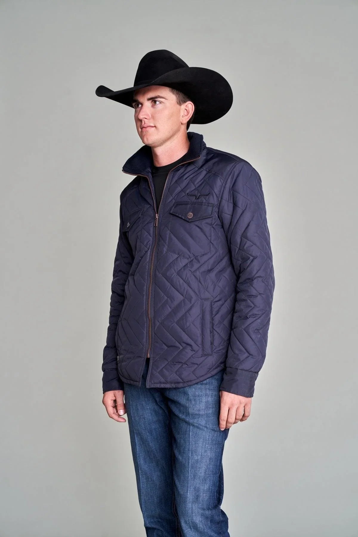 Kimes Ranch Skink Jacket in Navy, side view, with a chevron quilted pattern and front zip closure